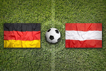 Image showing Germany vs. Austria flags on soccer field