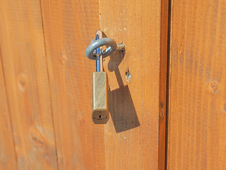 Image showing Padlock on a wood door