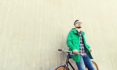 Image showing happy young hipster man with fixed gear bike