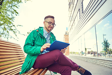 Image showing happy young hipster man with tablet pc and bike