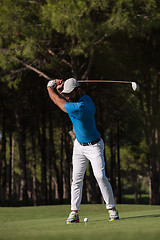 Image showing golf player hitting shot