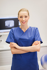 Image showing happy female dentist at dental clinic office