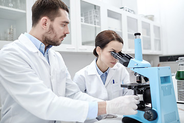 Image showing young scientists making test or research in lab