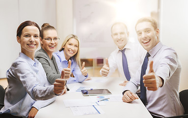 Image showing business team showing thumbs up in office