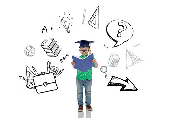 Image showing boy in bachelor hat and eyeglasses reading book