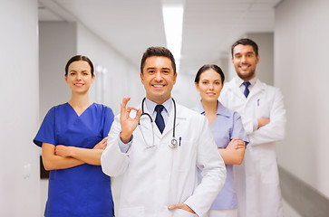 Image showing group of medics at hospital showing ok hand sign