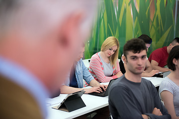Image showing teacher with a group of students in classroom
