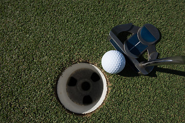 Image showing hitting golf ball to hole