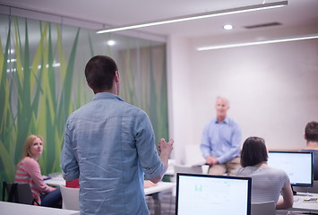 Image showing student answering a question in classroom