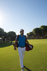 Image showing golf player walking