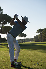 Image showing golf player hitting shot