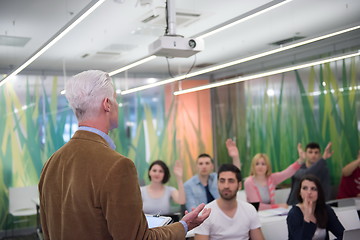 Image showing teacher with a group of students in classroom