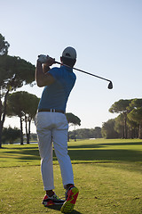 Image showing golf player hitting shot