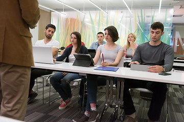 Image showing teacher with a group of students in classroom