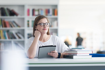 Image showing student with tablet in library