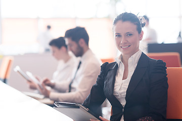 Image showing business woman on meeting  using tablet