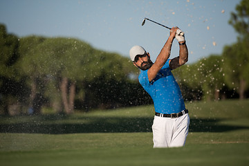 Image showing pro golfer hitting a sand bunker shot