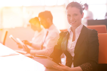 Image showing business woman at  office people group on meeting  in background