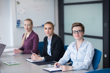 Image showing young business people group on team meeting at modern office