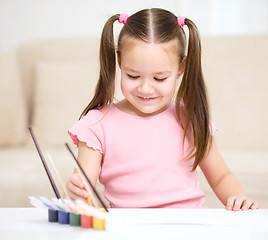 Image showing Cute cheerful child play with paints