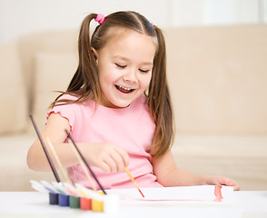 Image showing Cute cheerful child play with paints