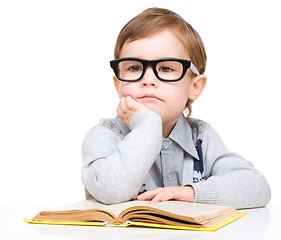 Image showing Little child play with book