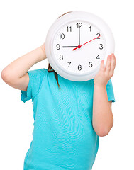 Image showing Little girl is holding big clock