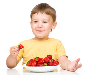 Image showing Little boy with strawberries