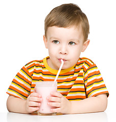 Image showing Cute little boy with a glass of milk