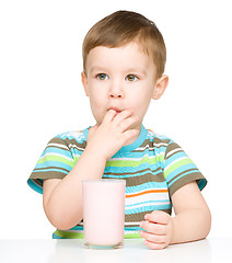 Image showing Cute little boy with a glass of milk