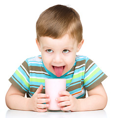 Image showing Cute little boy with a glass of milk