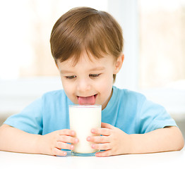 Image showing Cute little boy with a glass of milk