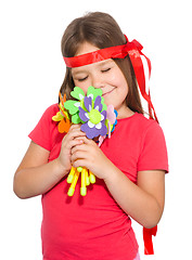 Image showing Cute little girl wit a bunch of flowers