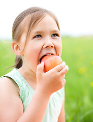 Image showing Portrait of a little girl with apple