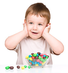 Image showing Portrait of a boy with candies