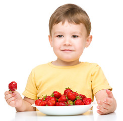 Image showing Little boy with strawberries