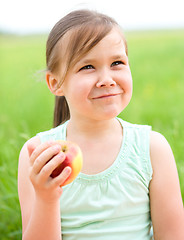 Image showing Portrait of a little girl with apple