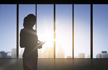 Image showing silhouette of business woman with tablet pc