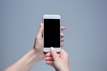 Image showing Closeup shot of a woman typing on mobile phone 