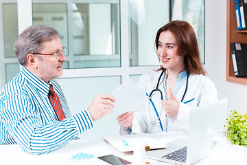 Image showing The patient and his doctor in medical office