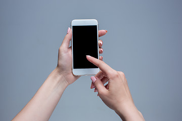 Image showing Closeup shot of a woman typing on mobile phone 