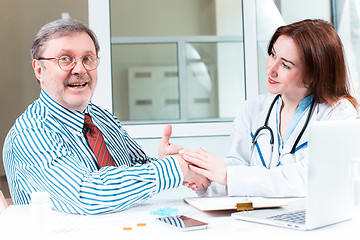 Image showing The patient and his doctor in medical office