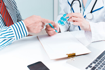 Image showing The patient and his doctor in medical office