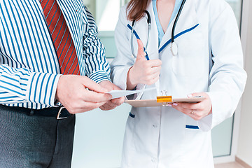 Image showing Close-up of doctor and patient hands