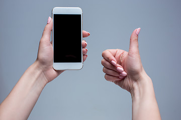 Image showing Closeup shot of a woman typing on mobile phone 