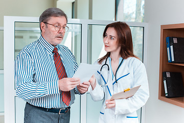 Image showing The patient and his doctor in medical office