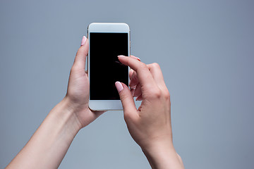 Image showing Closeup shot of a woman typing on mobile phone 