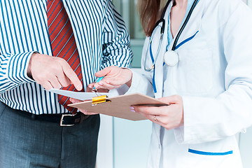 Image showing Close-up of doctor and patient hands