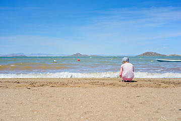 Image showing Small girl playing on the Mar Menor beach