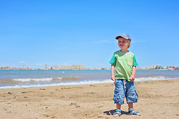 Image showing Cute small boy standing on the beach